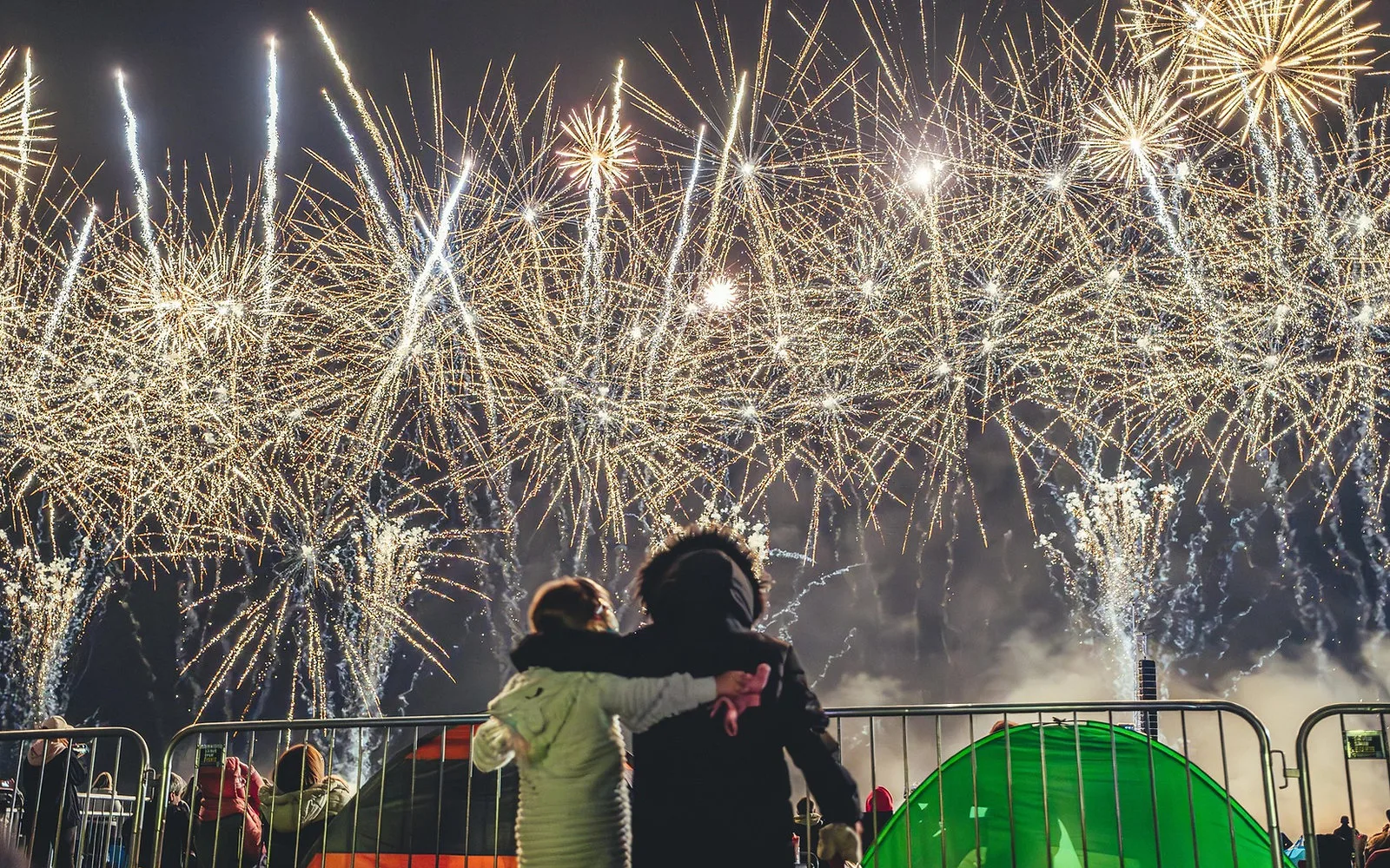 Spectacular fireworks finale lighting up the night sky in a 270° arc