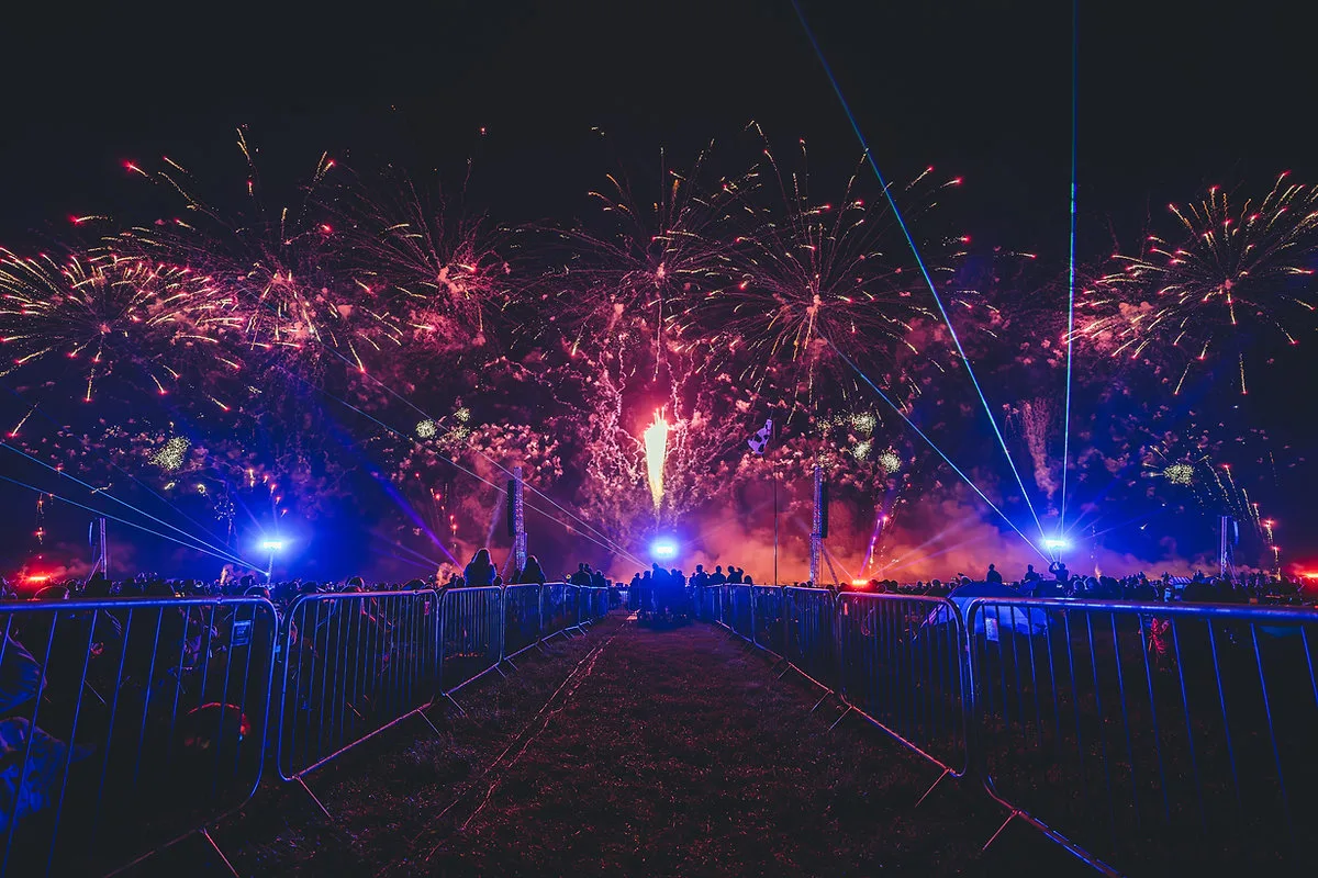Fairground rides lit up at night